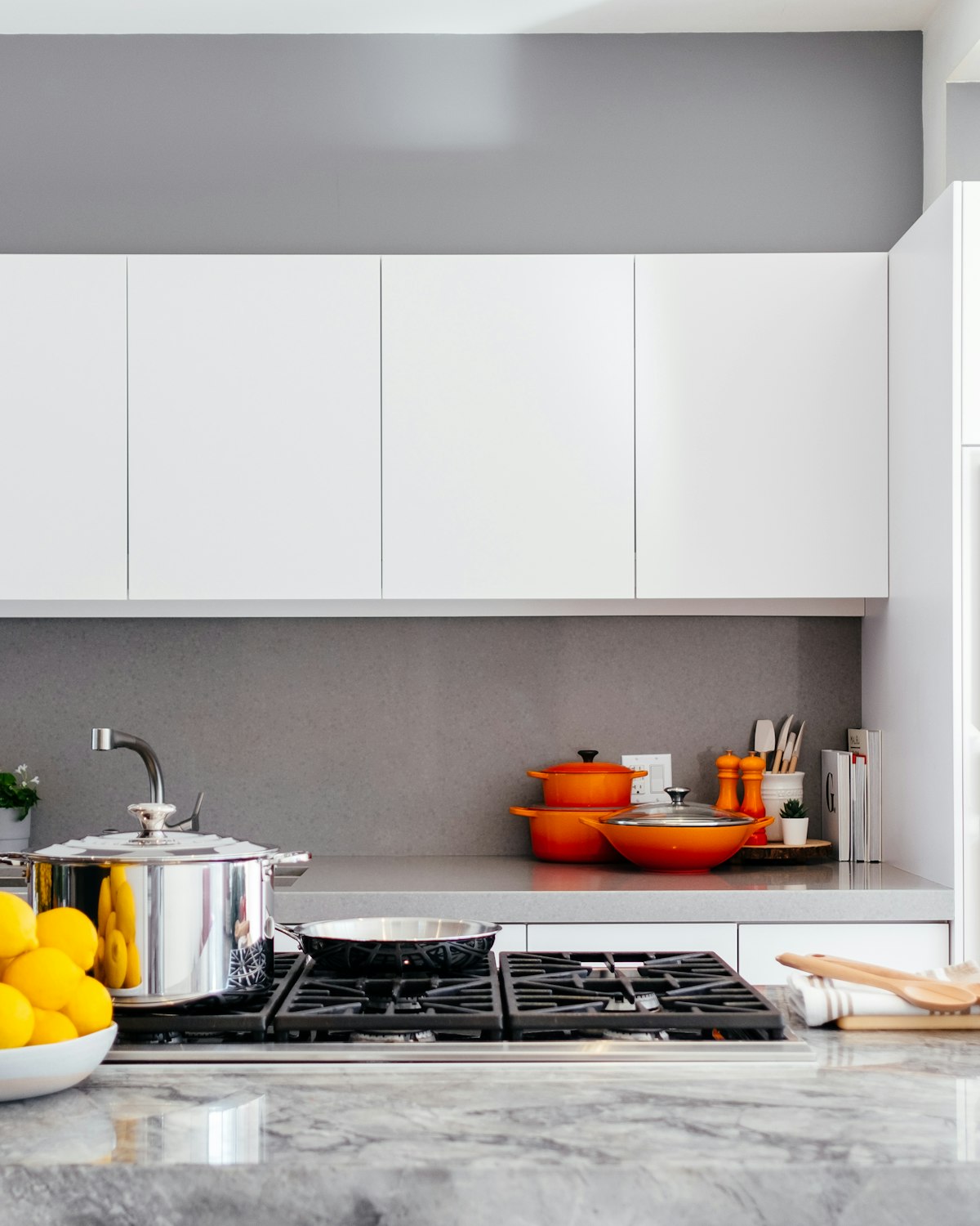 A bright, spotless modern apartment kitchen after a professional clean